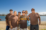 Brown Image Car Club: Photograph of Brown Image Car Club members with club plaque at Lowrider Council event at Mission Bay