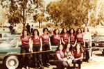 Ladies Pride Car Club: Photograph of Monica Camacho and original club members posing in front Monica’s green 1978 Cutlass Supreme at J Street Marina Park in Chula Vista, CA