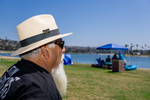 Latin Lowriders Car Club: Photograph of Richie Burgos, club member, at Lowrider Council event at Mission Bay