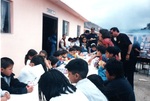 Oldies Car Club: Photograph of club members hosting a picnic lunch for children at the Tijuana orphanage "Casa De La Esperanza"